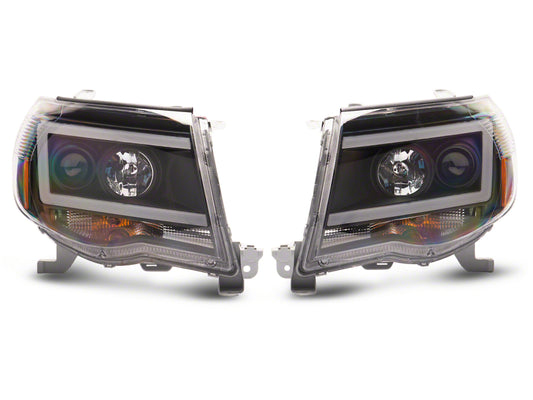 Raxiom 05-11 Toyota Tacoma Axial Series LED DRL Projector Headlights- Black Housing (Clear Lens)