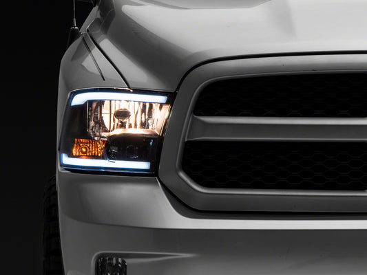Raxiom 09-18 Dodge RAM 1500/2500/3500 Axial Series Headlights w/ LED Bar- Black Housing (Clear Lens)