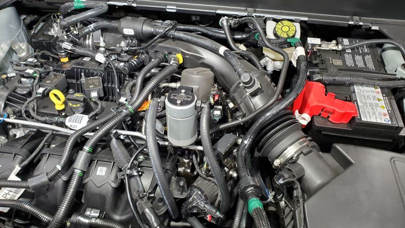 J&amp;L 19-23 Ford/Lincoln SUVs &amp; Trucks w 2.0 EcoBoost Driver Side Oil Separator 3.0 - Clear An